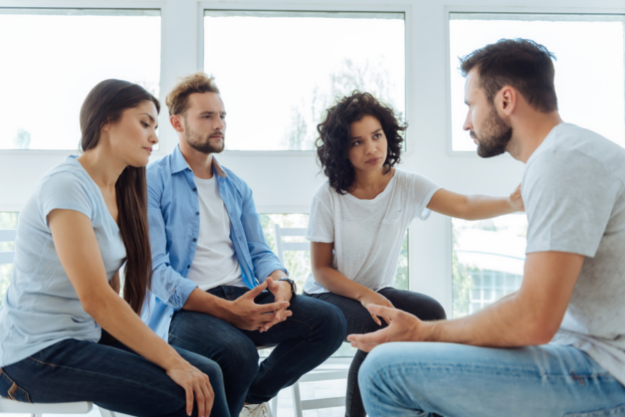 People talking to sad friend